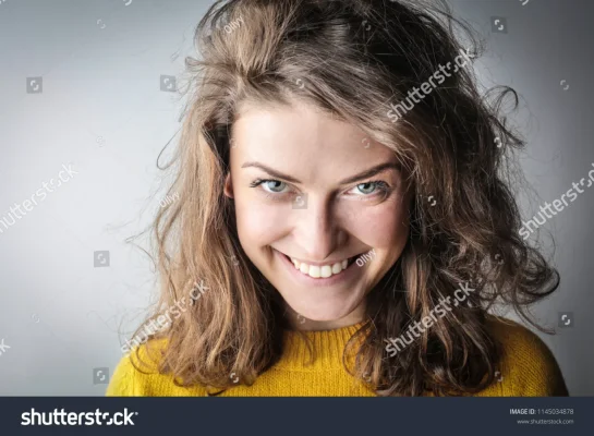 stock-photo-young-woman-smiling-1145034878.webp
