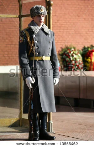 stock-photo-russian-soldier-with-the-weapon-standing-at-attention-13555462.webp
