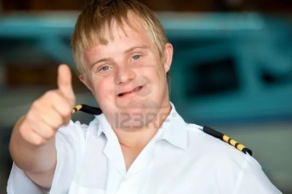 17902958-portrait-of-young-pilot-with-down-syndrome-showing-thumbs-up.webp