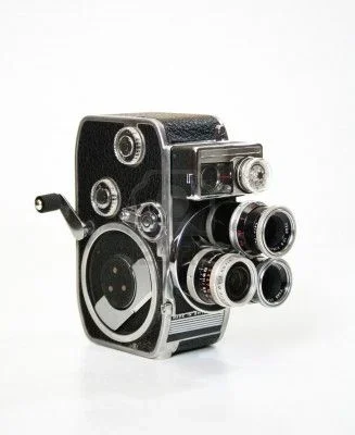 2761569-old-8mm-cine-film-camera-with-turrent-and-crank.webp